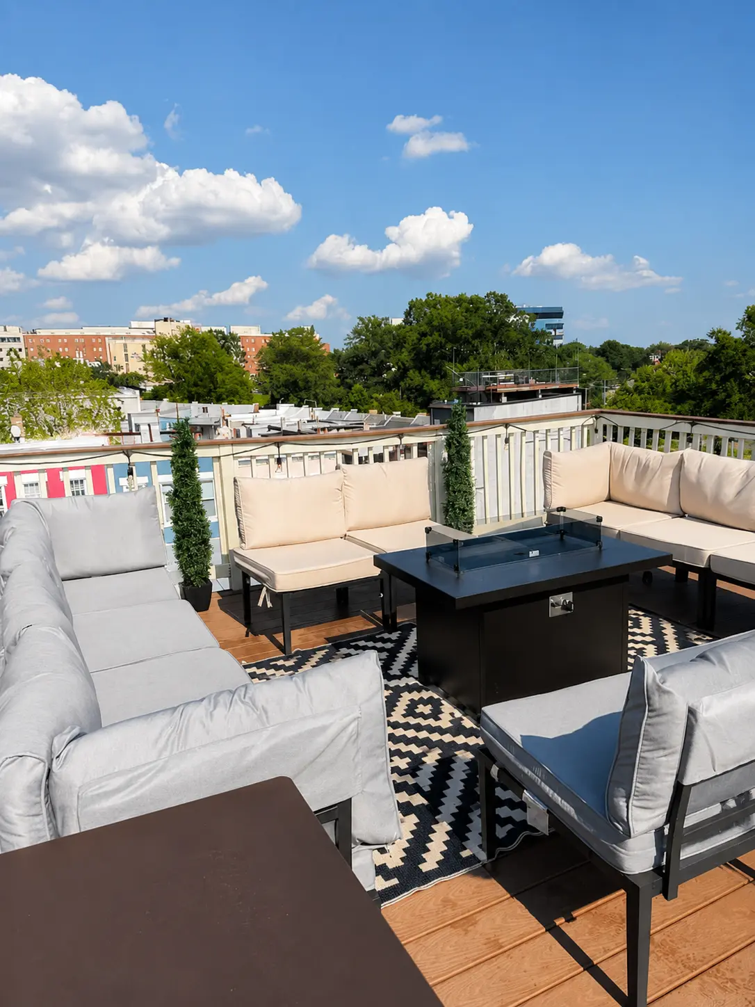 Rooftop seating beneath a bright blue sky