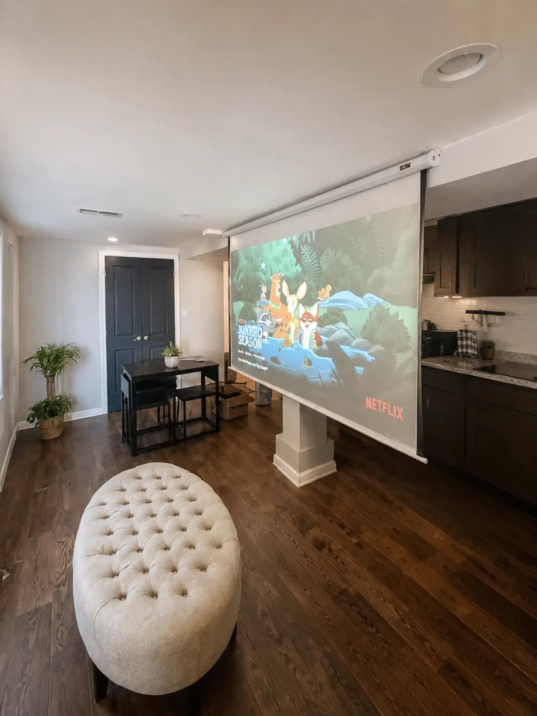 Studio projector displaying a movie across from the seating area